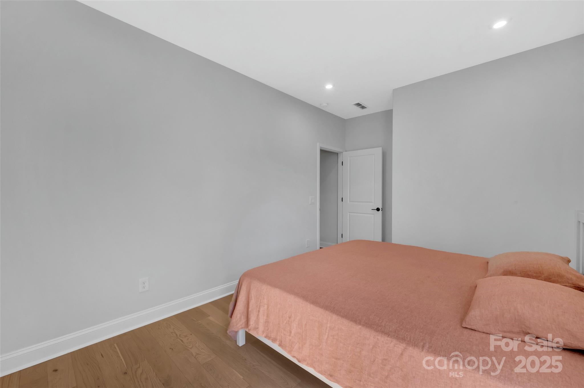 1185 Regions Boulevard Indian Land, SC 29707 - Photo 19 of 41 a bedroom with a bed and a wall painting