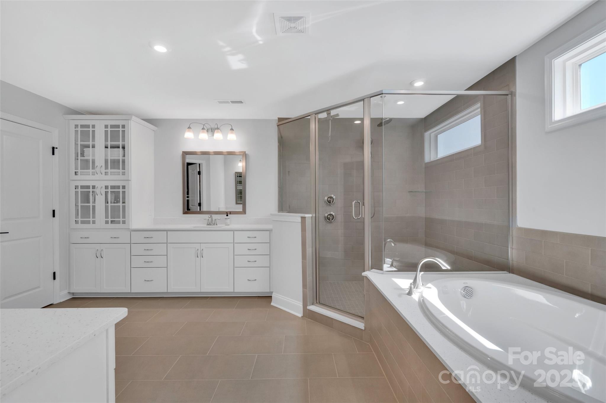 1185 Regions Boulevard Indian Land, SC 29707 - Photo 21 of 41 a large spacious bathroom with a granite countertop tub sink shower and mirror
