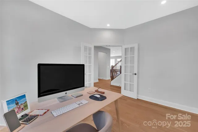 a bedroom with bed and a flat screen tv
