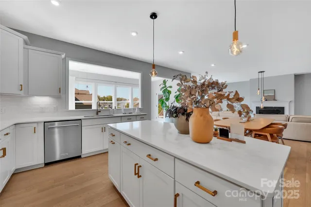 a kitchen with sink refrigerator and window