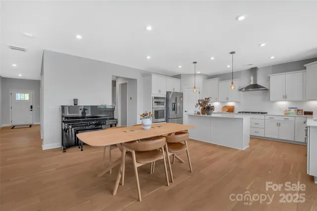 a kitchen with a table and chairs in it