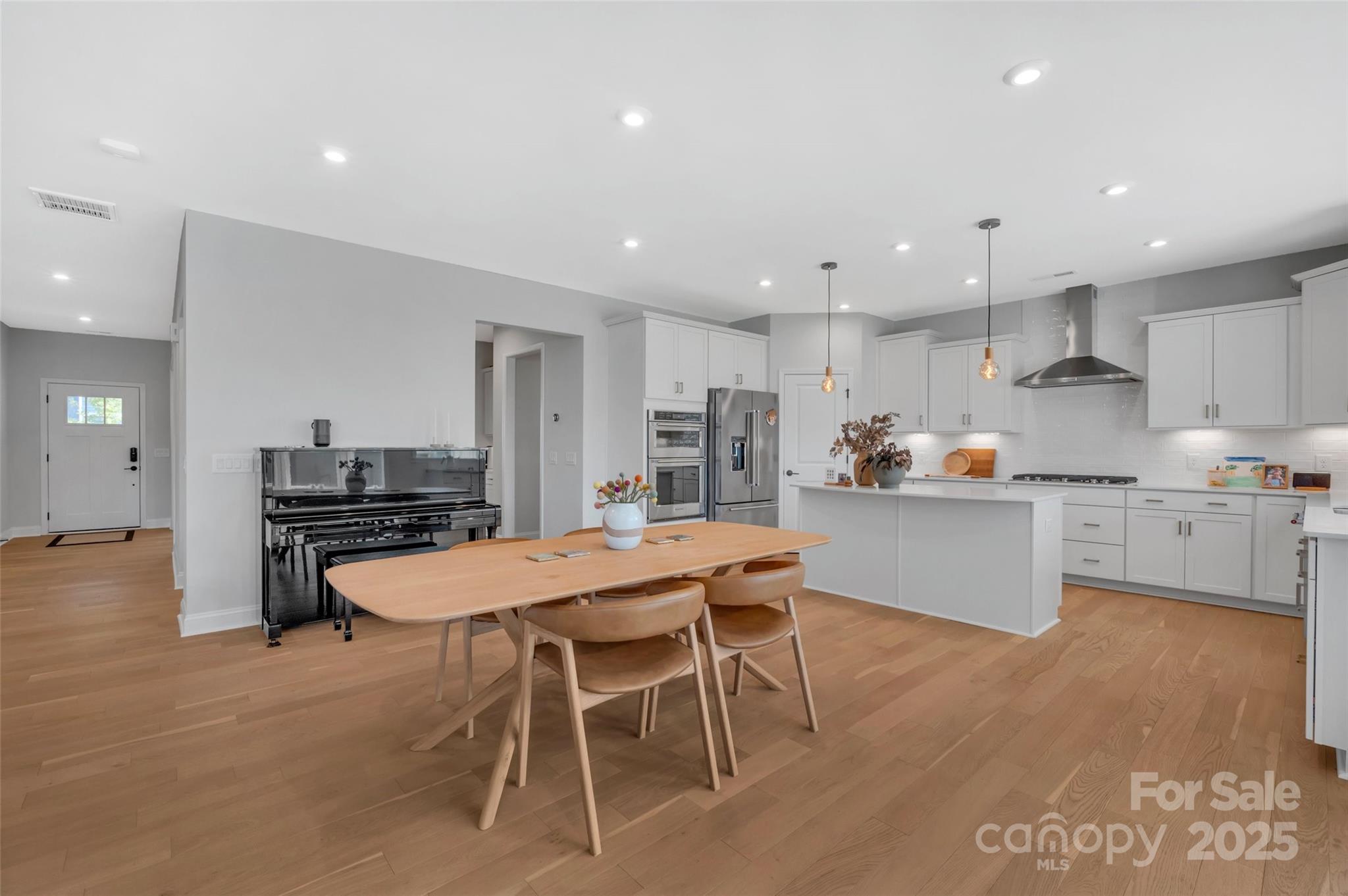 1185 Regions Boulevard Indian Land, SC 29707 - Photo 10 of 41 a kitchen with a table and chairs in it