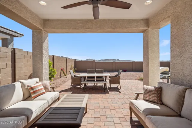 a living room with furniture a lamp and a table