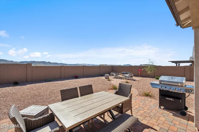 a terrace of a house with outdoor seating
