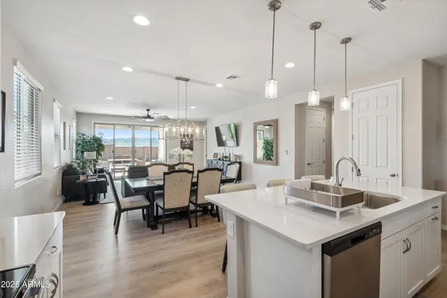 a large kitchen with a table and chairs