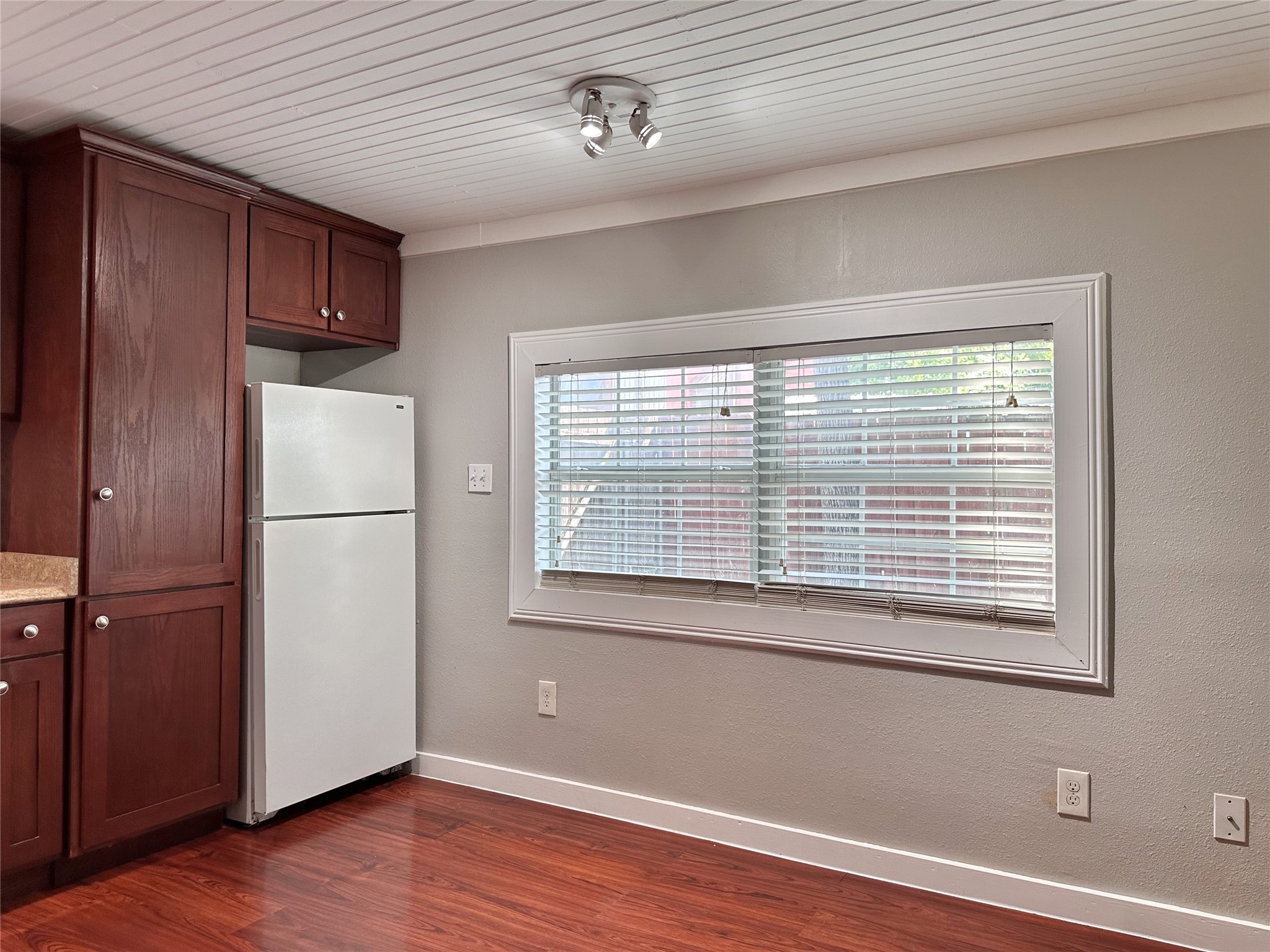 2103 East 16th Street, Unit ANNEX Austin, TX 78702 - Photo 13 of 23 a view of an empty room with wooden floor and a window