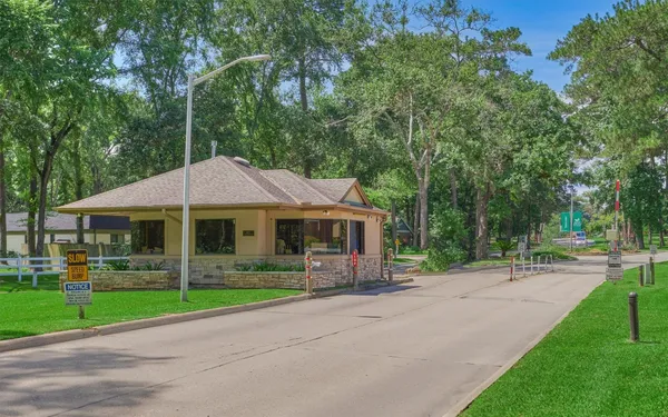 an aerial view of residential houses with outdoor space and street view