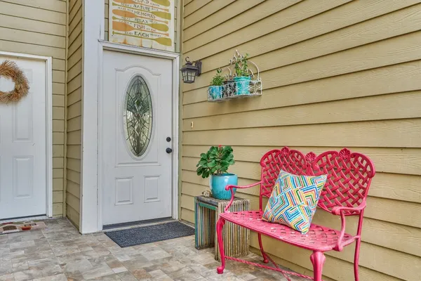 a view of a door and chair in the patio