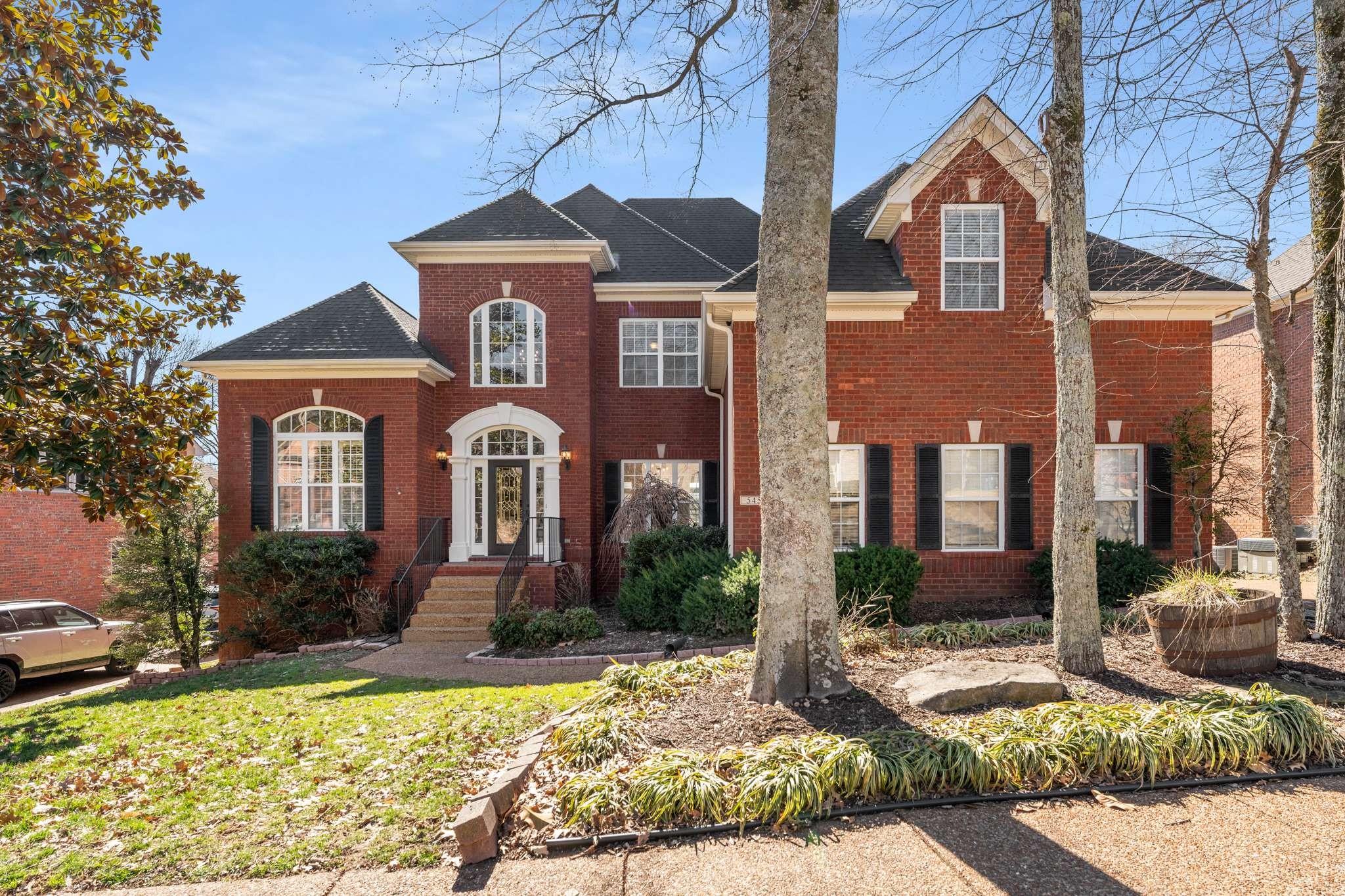 a front view of a house with a yard