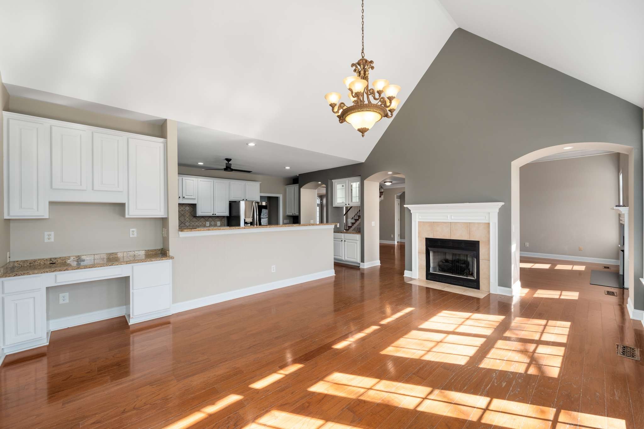 545 Brixham Park Drive Franklin, TN 37069 - Photo 14 of 39 a view of a kitchen with a sink dishwasher and a fireplace