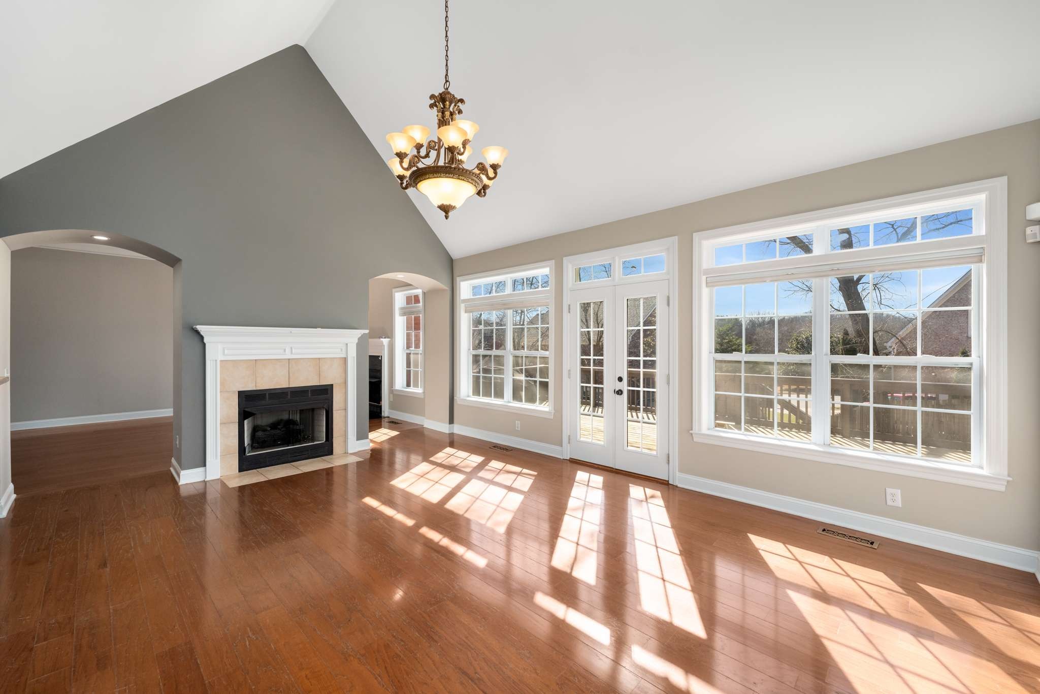 545 Brixham Park Drive Franklin, TN 37069 - Photo 15 of 39 a view of a livingroom with a fireplace wooden floor and windows