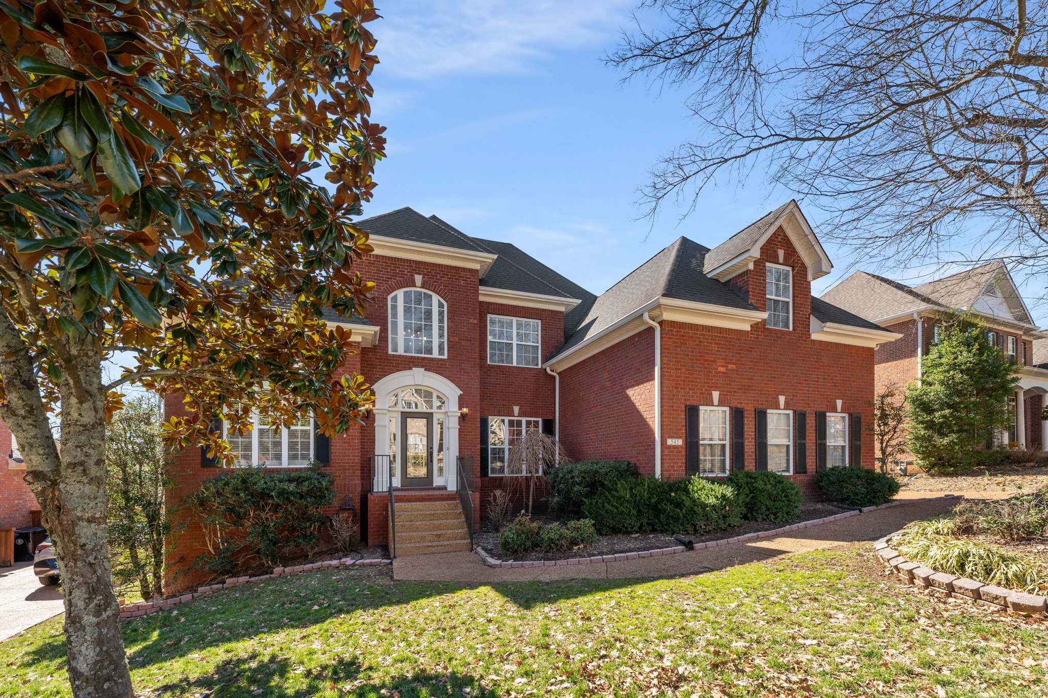 545 Brixham Park Drive Franklin, TN 37069 - Photo 2 of 39 a front view of a house with garden