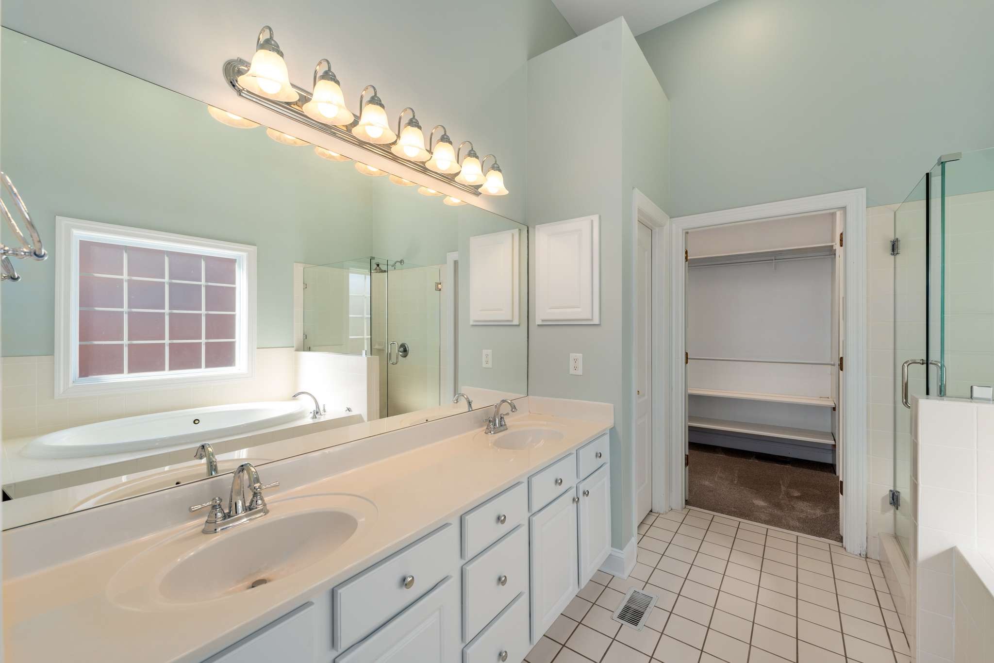 545 Brixham Park Drive Franklin, TN 37069 - Photo 21 of 39 a spacious bathroom with a double vanity sink a mirror and a shower