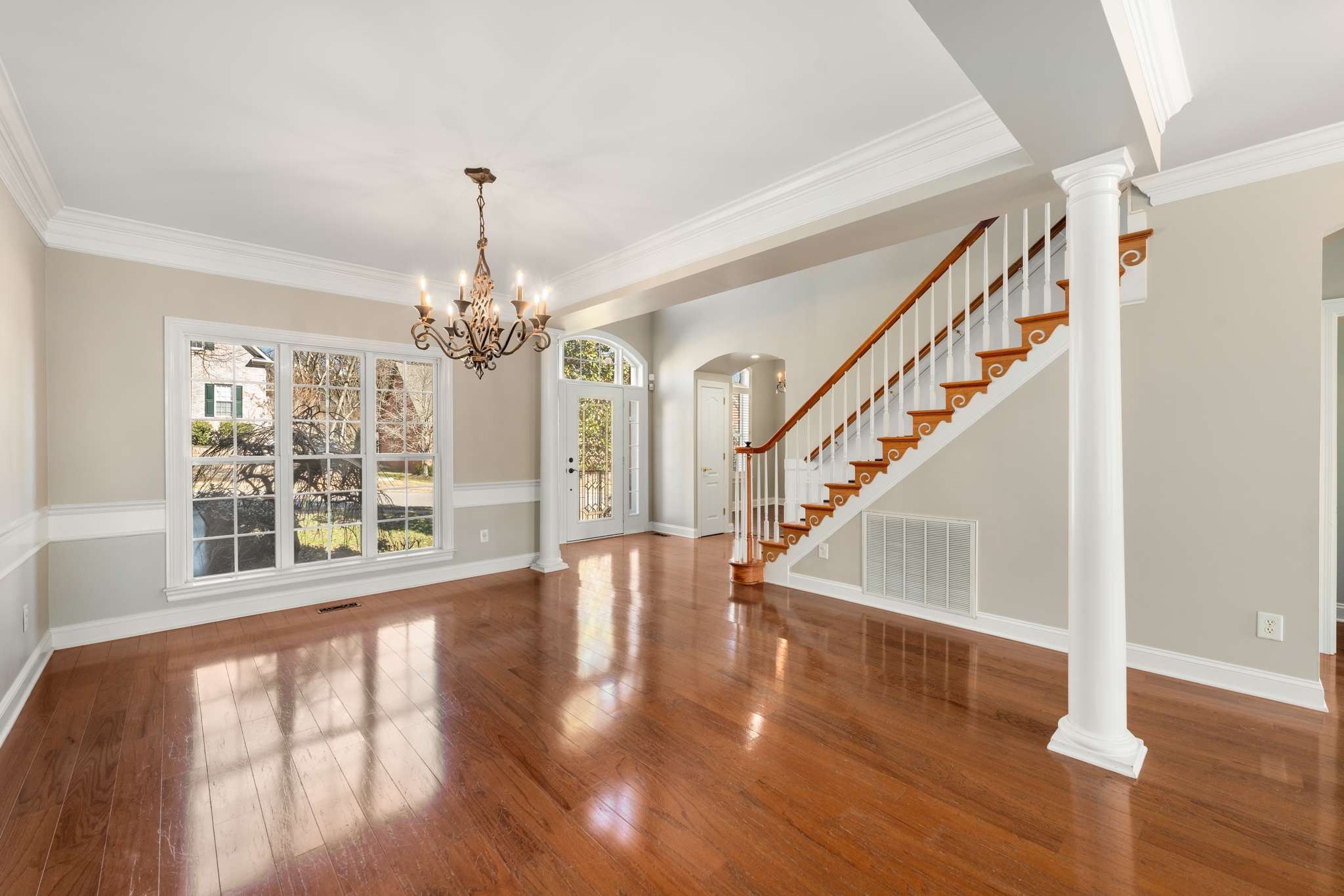 545 Brixham Park Drive Franklin, TN 37069 - Photo 5 of 39 a view of an entryway with wooden floor and a chandelier