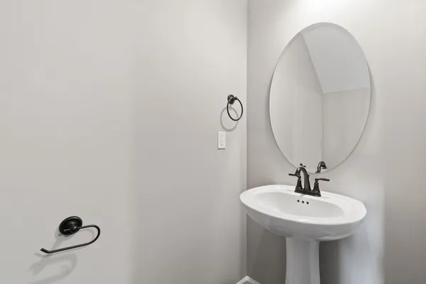 a bathroom with a sink and mirror