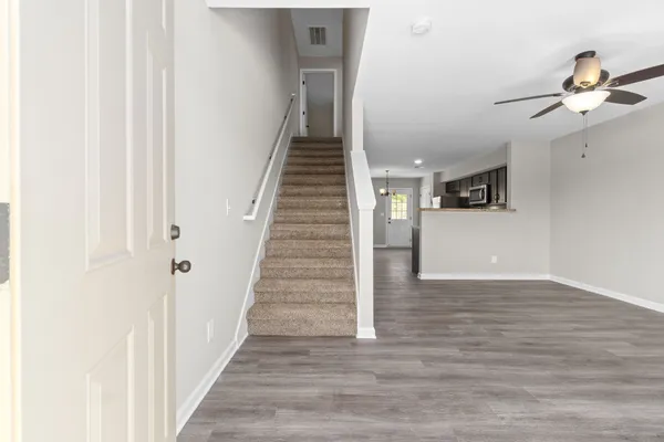 a view of a hallway view with staircase