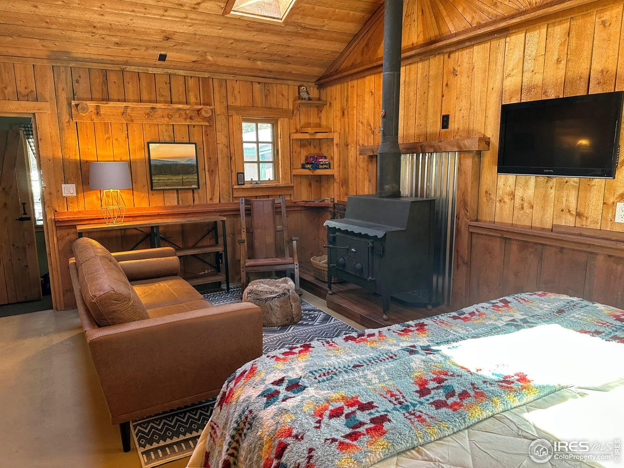 655 Nokomis Road Red Feather Lakes, CO 80545 - Photo 8 of 21 Woodstove for warmth and ambiance.