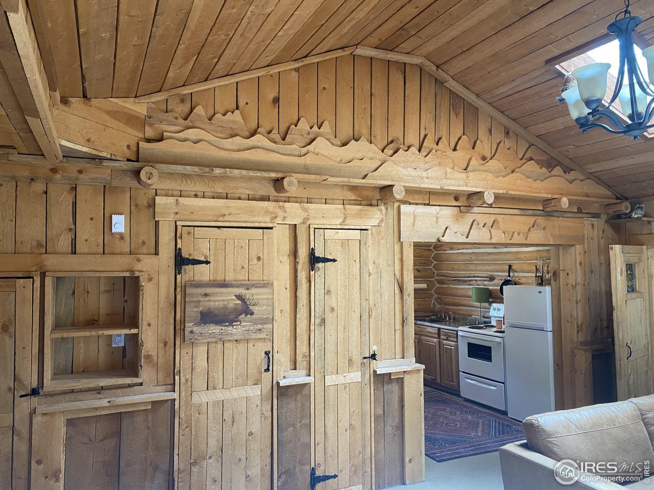 655 Nokomis Road Red Feather Lakes, CO 80545 - Photo 9 of 21 Custom wood designs throughout.