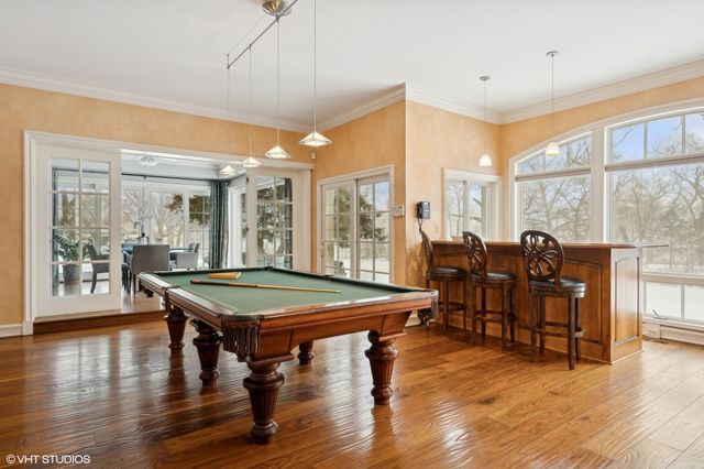 a living room with furniture and a large window with outer view