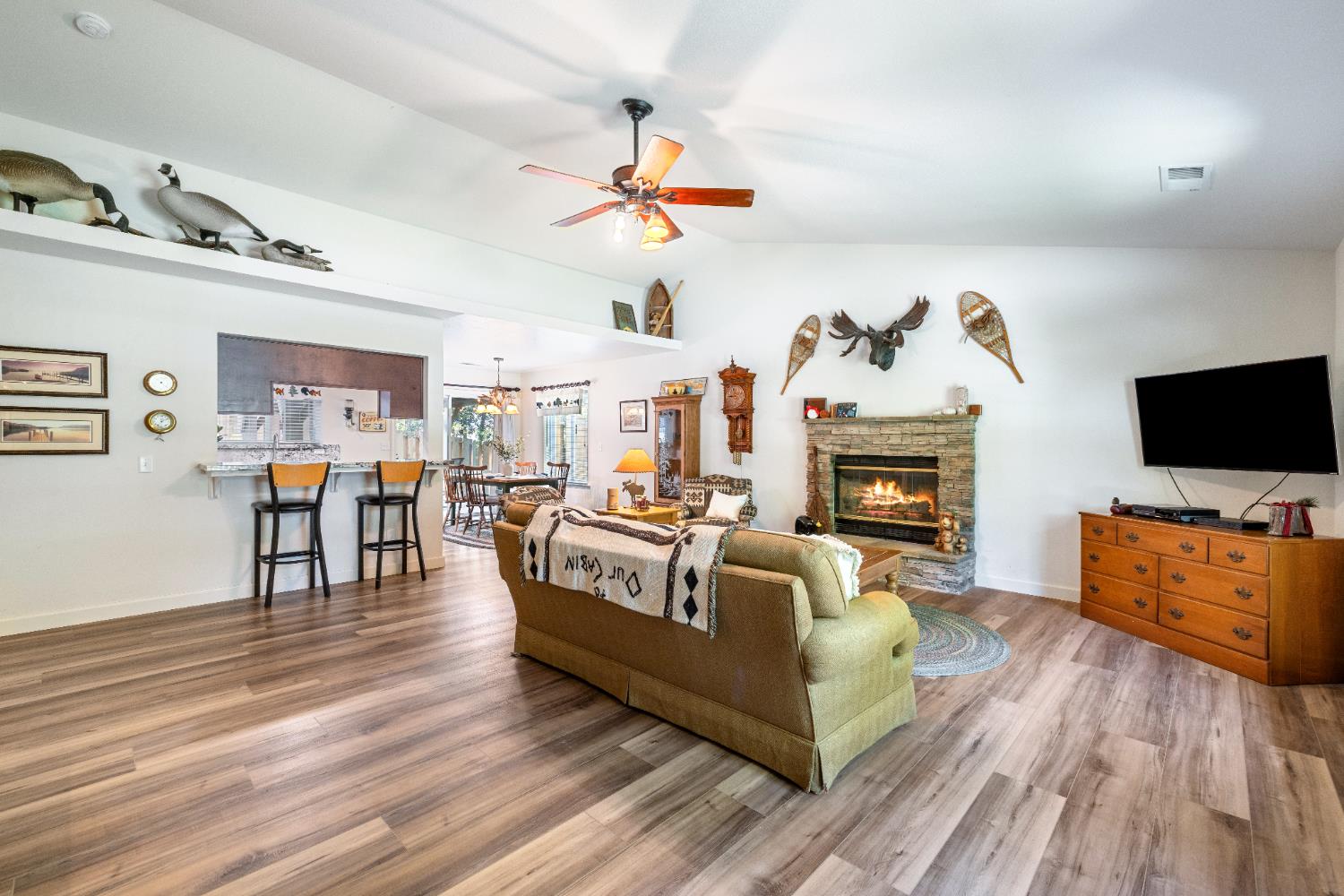 39398 Robin Bass Lake, CA 93604 - Photo 6 of 31 a living room with fireplace furniture and a flat screen tv