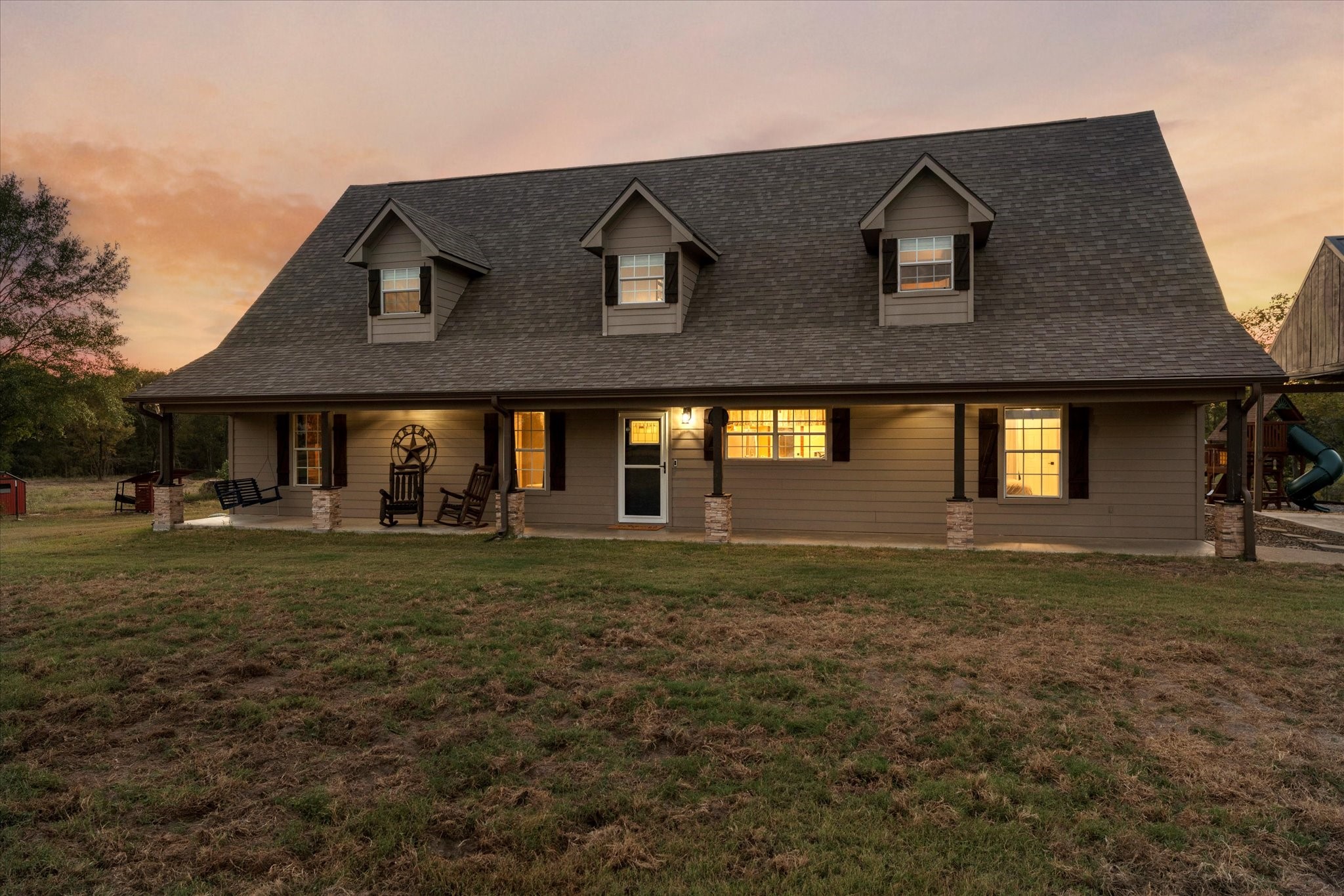 a front view of a house with a yard