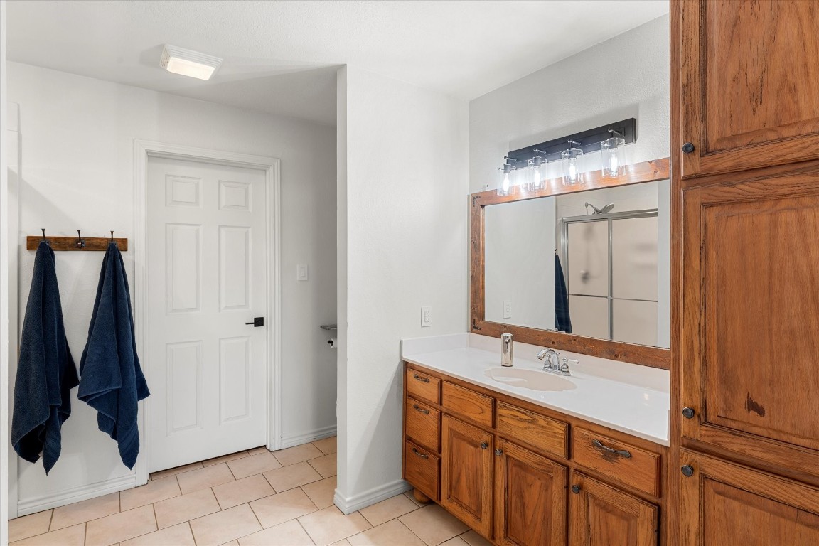 3115 Rains County Road 2610 Alba, TX 75410 - Photo 22 of 50 a bathroom with a double vanity sink and a mirror