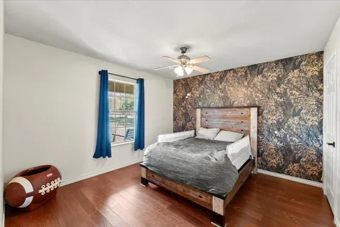 a bedroom with a bed and window