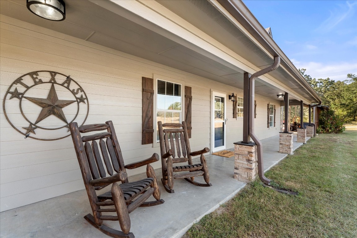 3115 Rains County Road 2610 Alba, TX 75410 - Photo 25 of 50 a view of patio with table and chairs and floor to ceiling window
