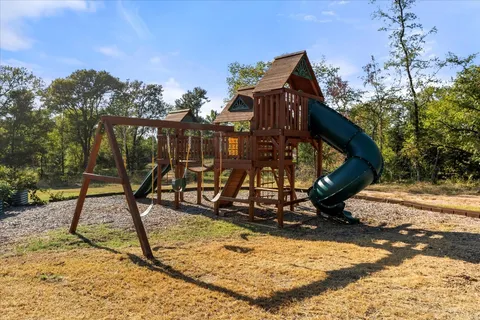 a view of a park with swings
