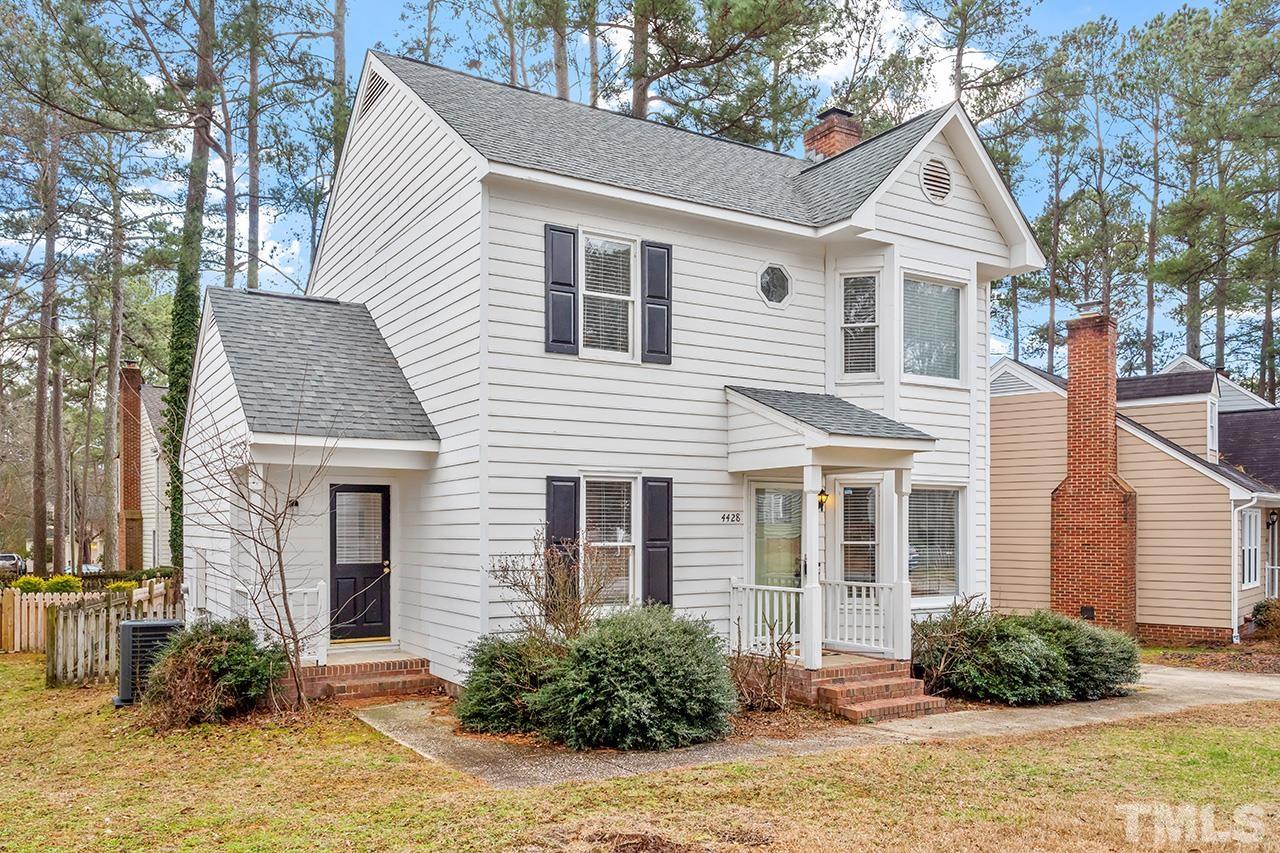 4428 Liverpool Lane Raleigh, NC 27604 - Photo 1 of 24 a front view of a house with a yard and potted plants