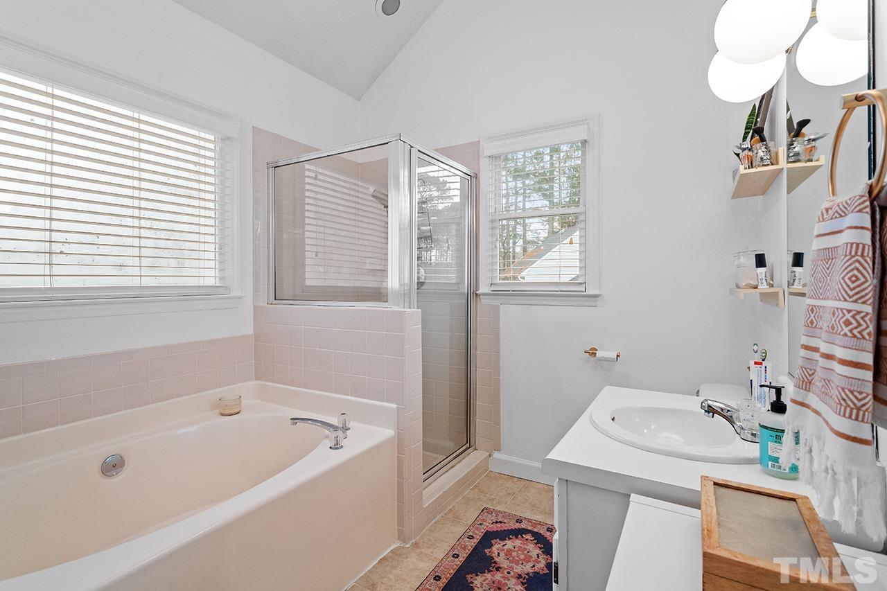 4428 Liverpool Lane Raleigh, NC 27604 - Photo 16 of 24 a bathroom with a sink a toilet and shower