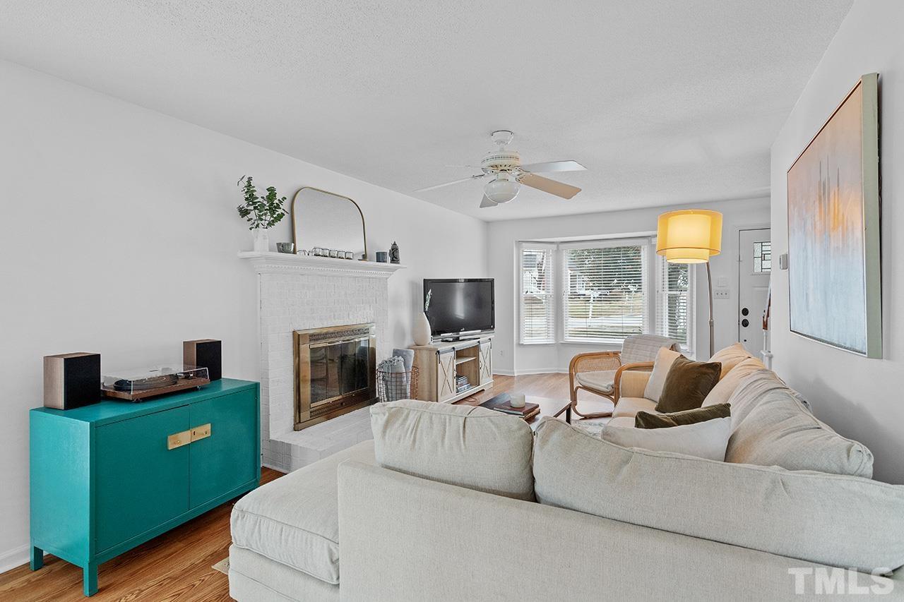 4428 Liverpool Lane Raleigh, NC 27604 - Photo 5 of 24 a living room with furniture and a fireplace