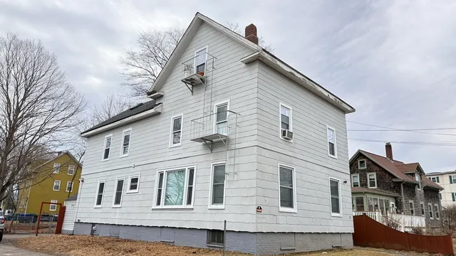 a front view of a house with large windows