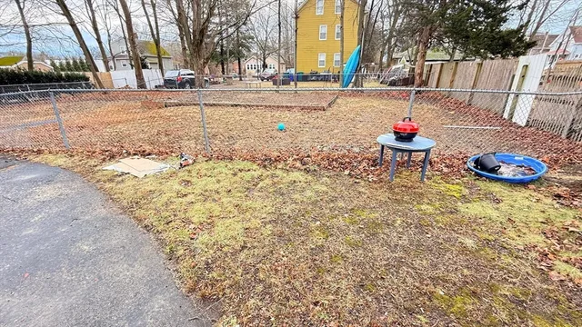 a backyard of a building with trees