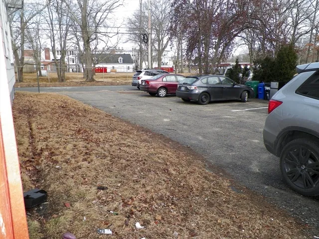 a view of street with parked cars