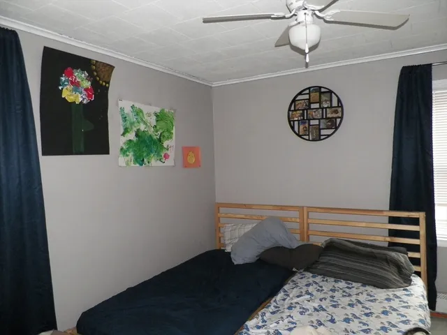 a view of a hallway with paintings on the wall