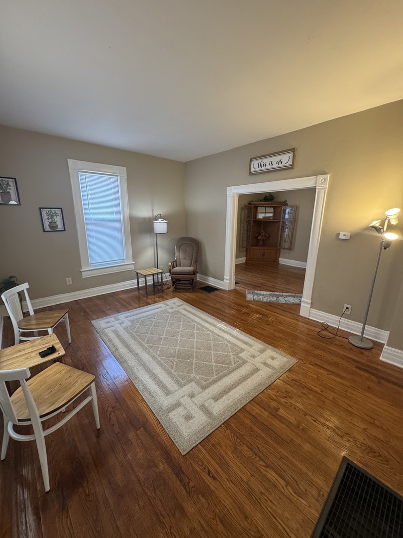 1108 East Main Street Urbana, IL 61802 - Photo 8 of 10 a view of a livingroom with furniture and wooden floor