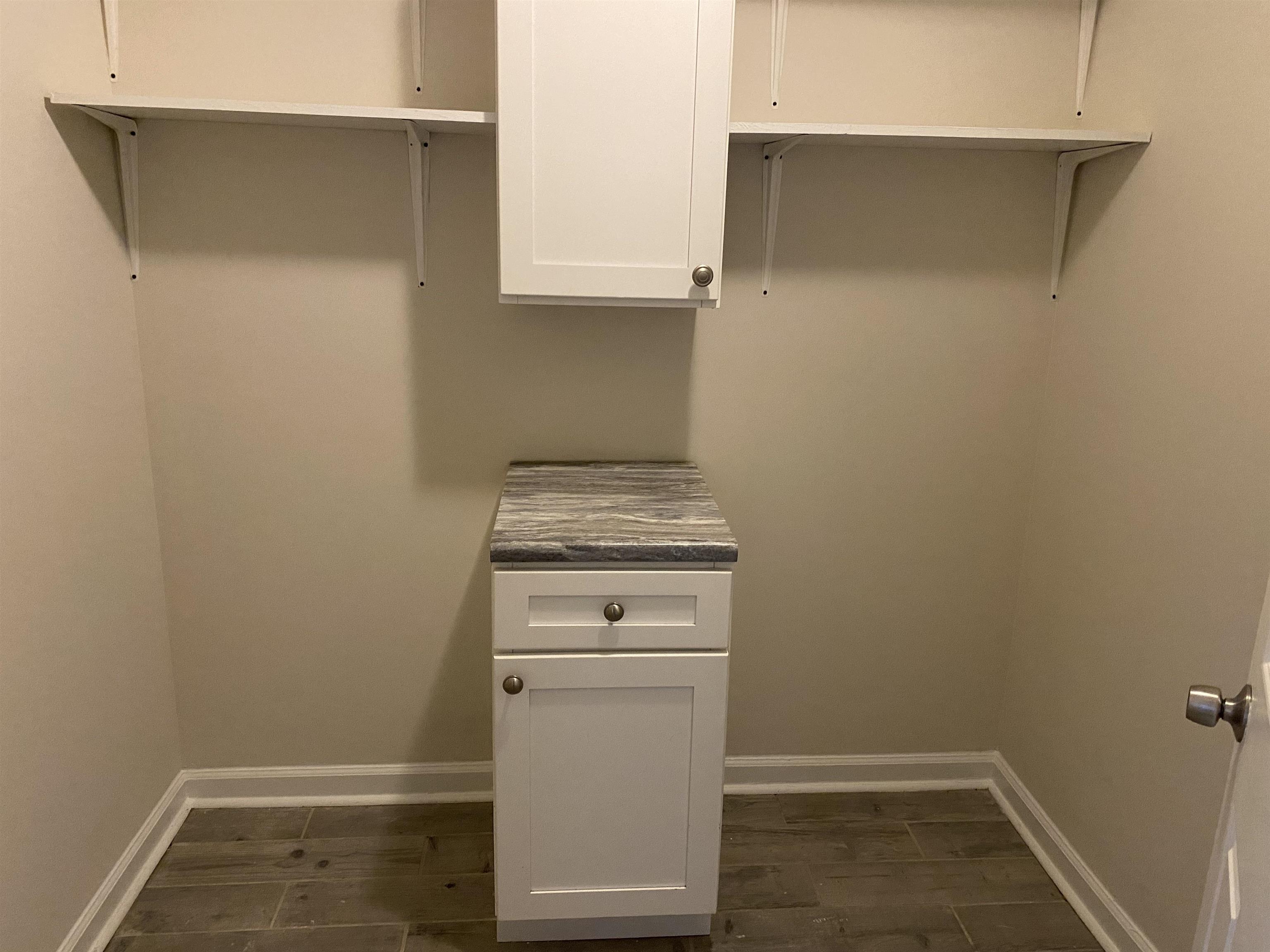 777 Archie Drive Memphis, TN 38127 - Photo 15 of 15 a view of a storage and utility room with washer and dryer