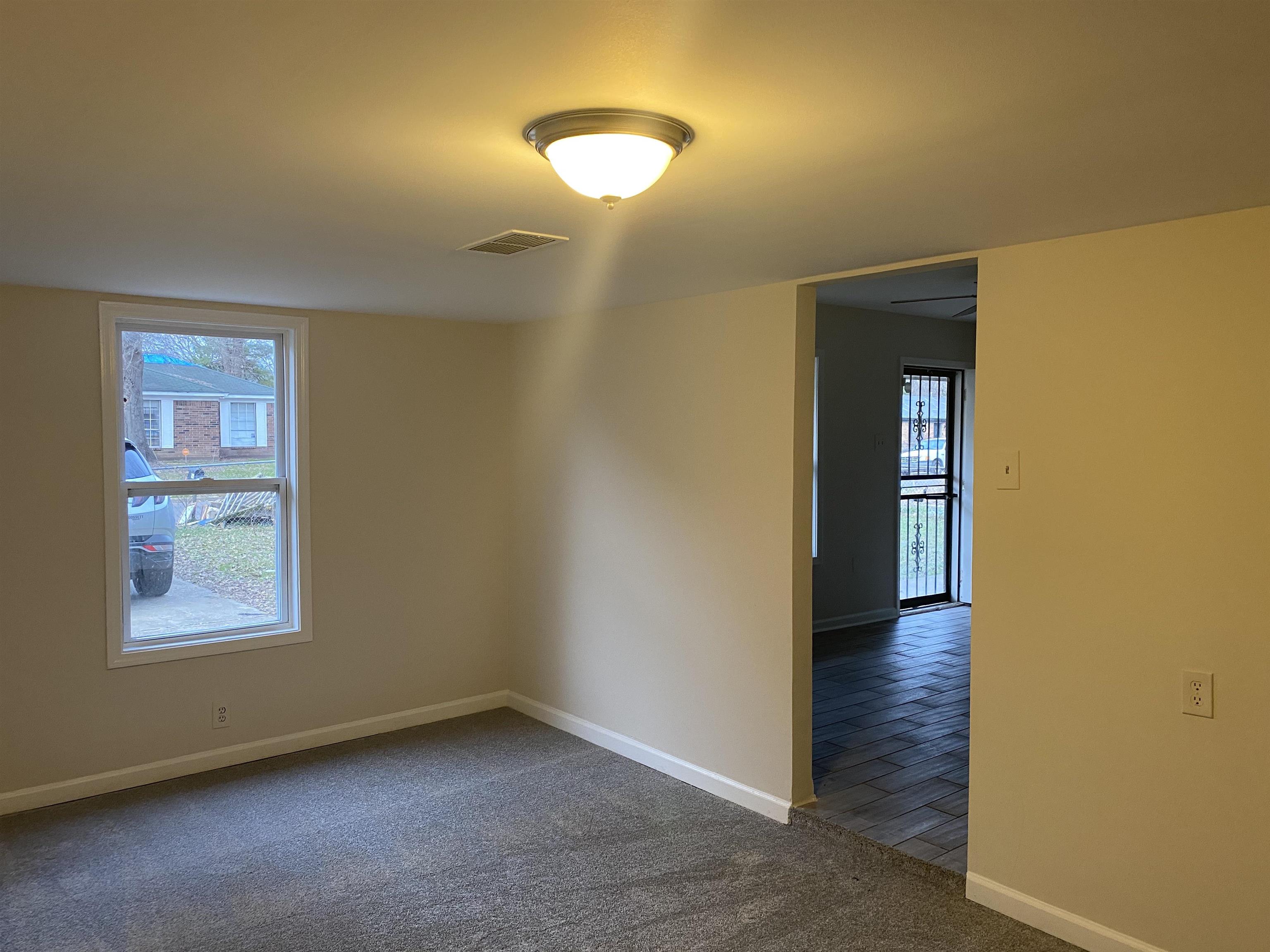 777 Archie Drive Memphis, TN 38127 - Photo 2 of 15 an empty room with windows and closet