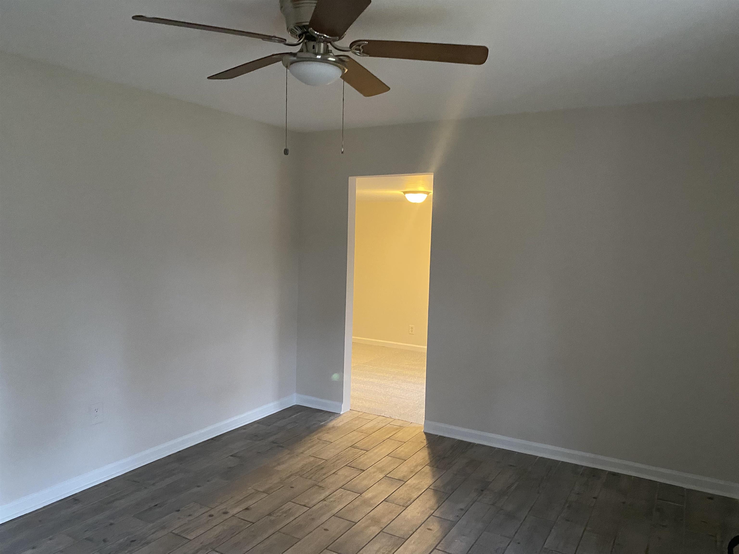 777 Archie Drive Memphis, TN 38127 - Photo 4 of 15 an empty room with a empty space and a ceiling fan