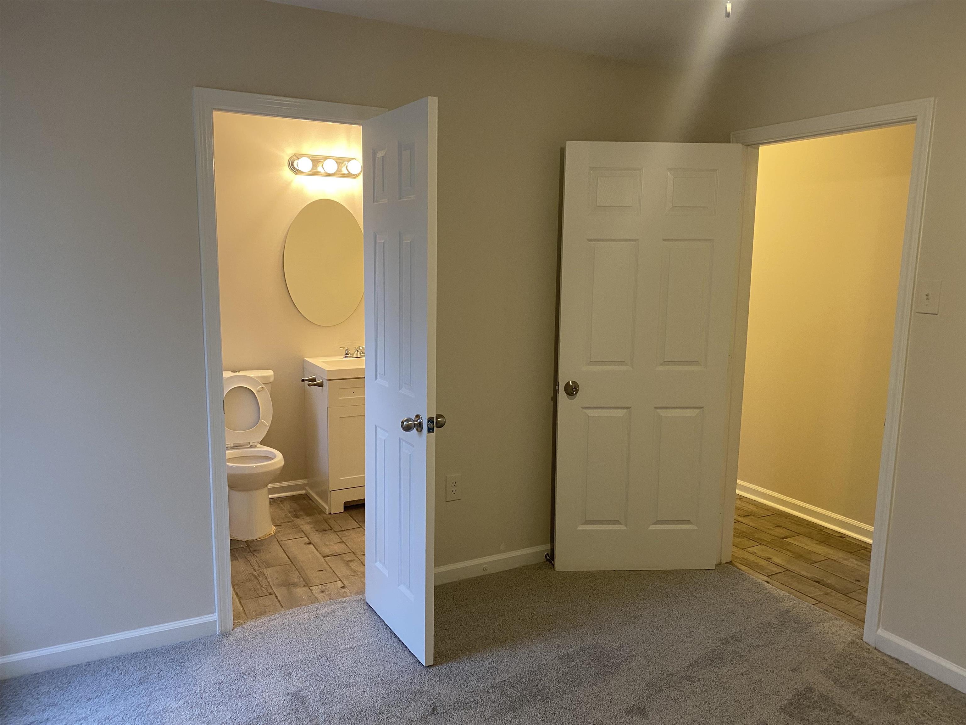 777 Archie Drive Memphis, TN 38127 - Photo 8 of 15 a bathroom with a granite countertop sink and a mirror