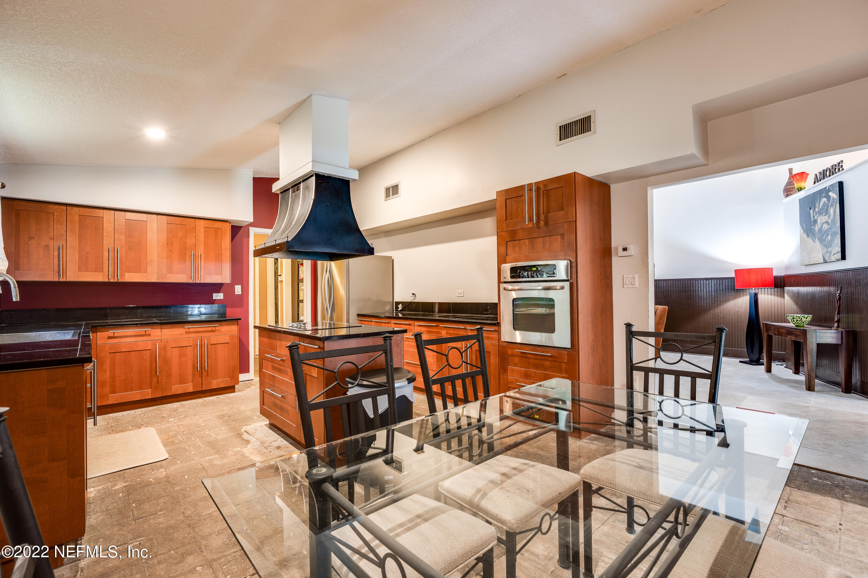 54528 Vikki Road Callahan, FL 32011 - Photo 14 of 41 a living room with furniture a flat screen tv and kitchen view