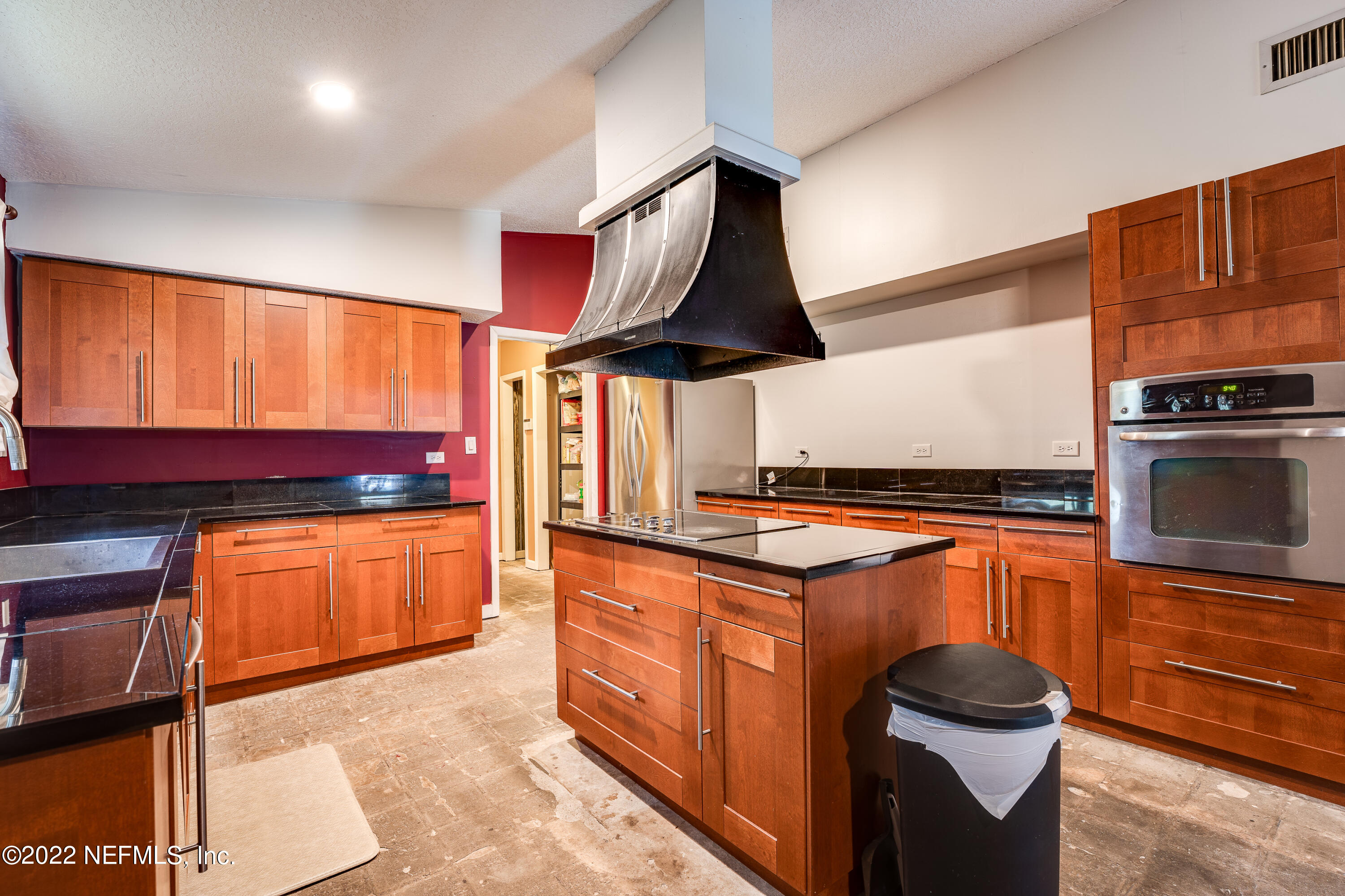 54528 Vikki Road Callahan, FL 32011 - Photo 15 of 41 a kitchen with stainless steel appliances granite countertop a stove a sink and a microwave