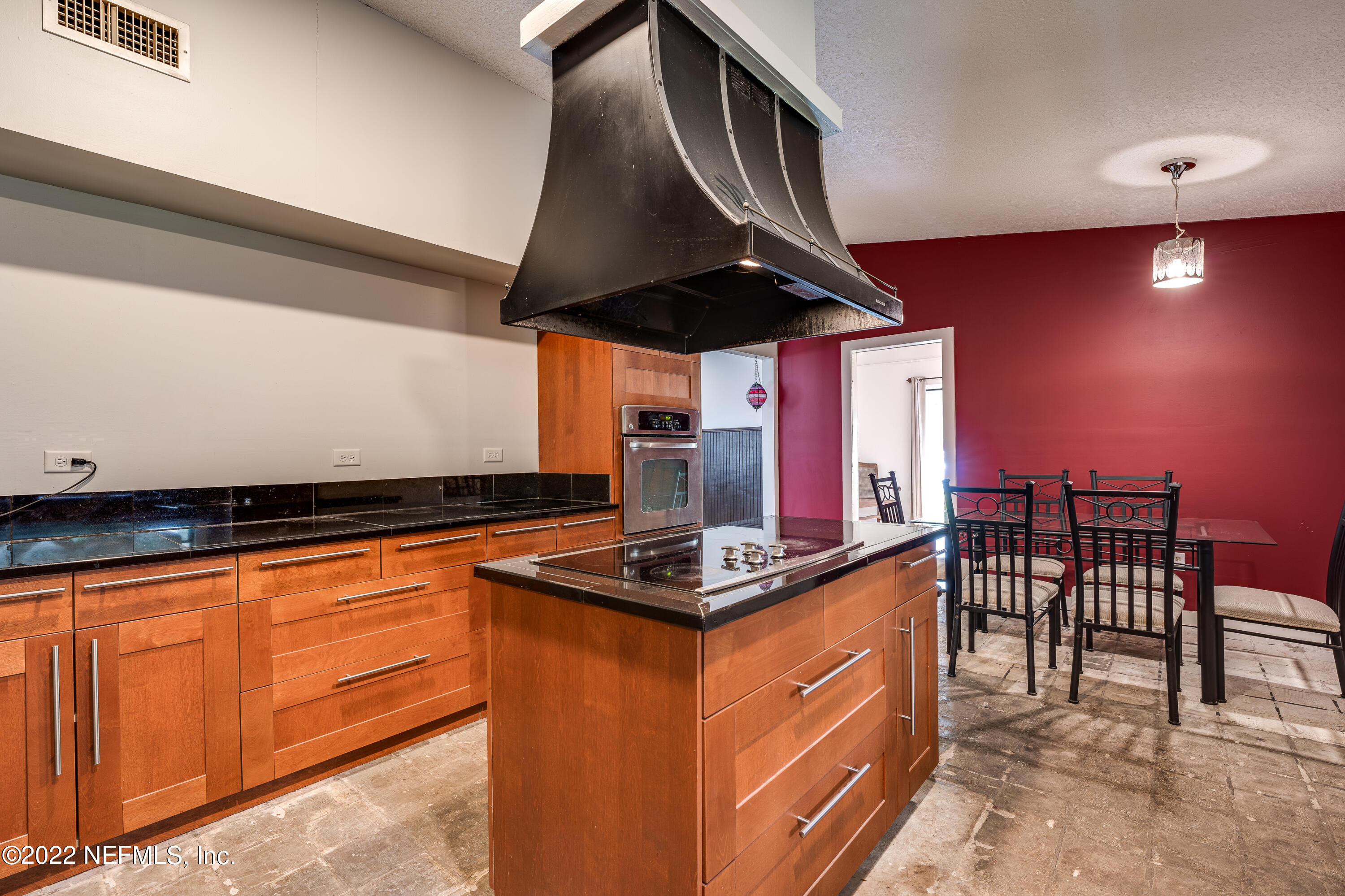 54528 Vikki Road Callahan, FL 32011 - Photo 18 of 41 a kitchen with stainless steel appliances granite countertop a stove a sink and a refrigerator