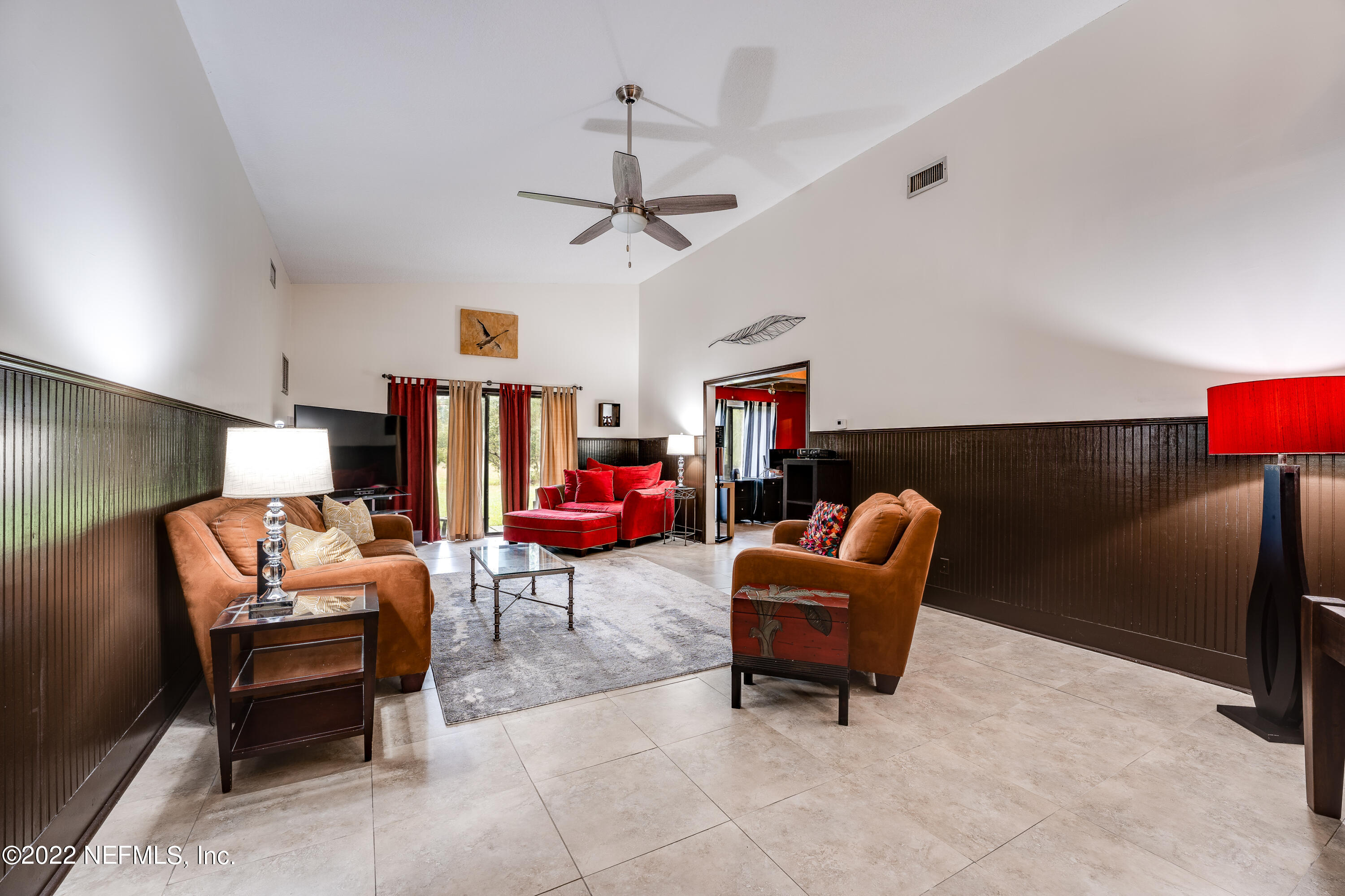 54528 Vikki Road Callahan, FL 32011 - Photo 24 of 41 a living room with furniture and a lamp