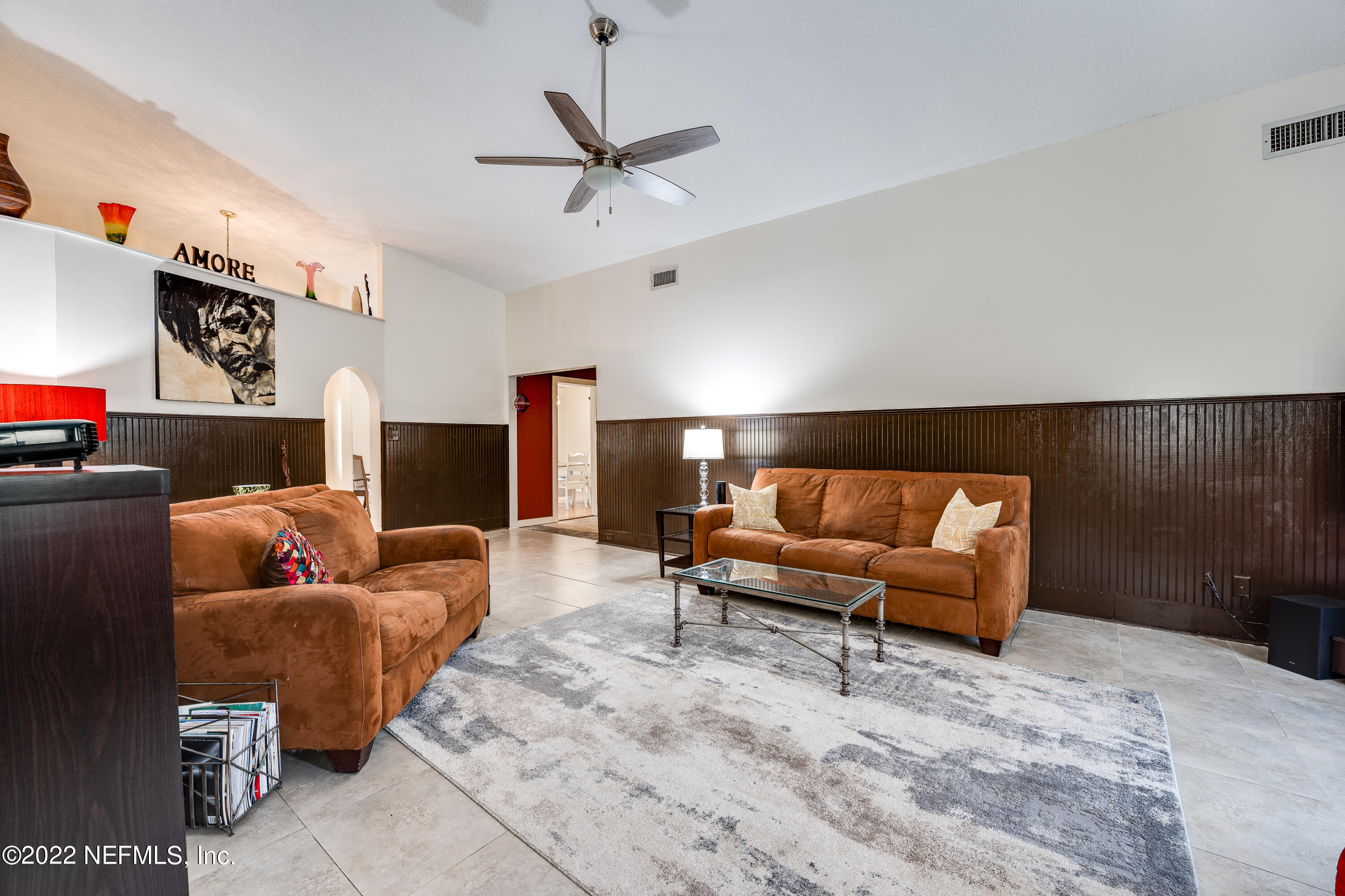 54528 Vikki Road Callahan, FL 32011 - Photo 26 of 41 a living room with furniture and a flat screen tv