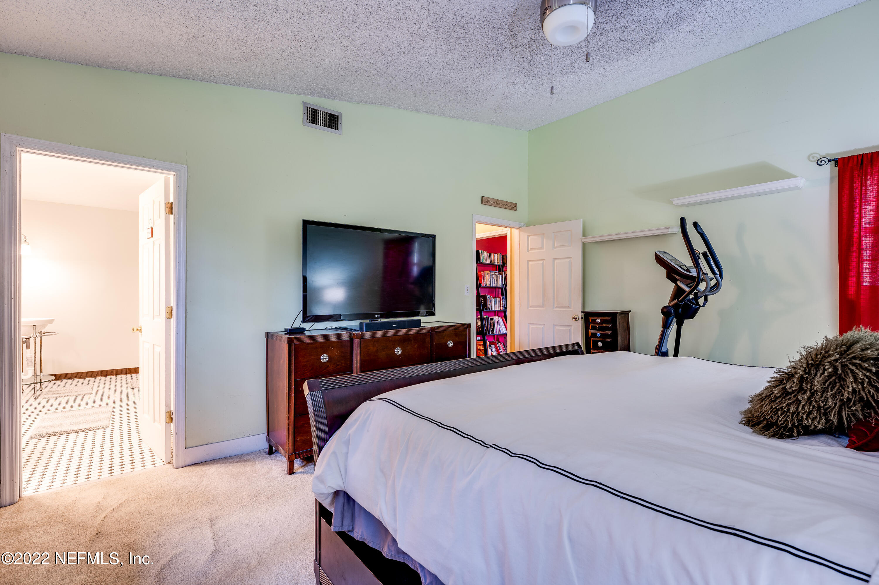 54528 Vikki Road Callahan, FL 32011 - Photo 31 of 41 a bedroom with a bed and a flat screen tv