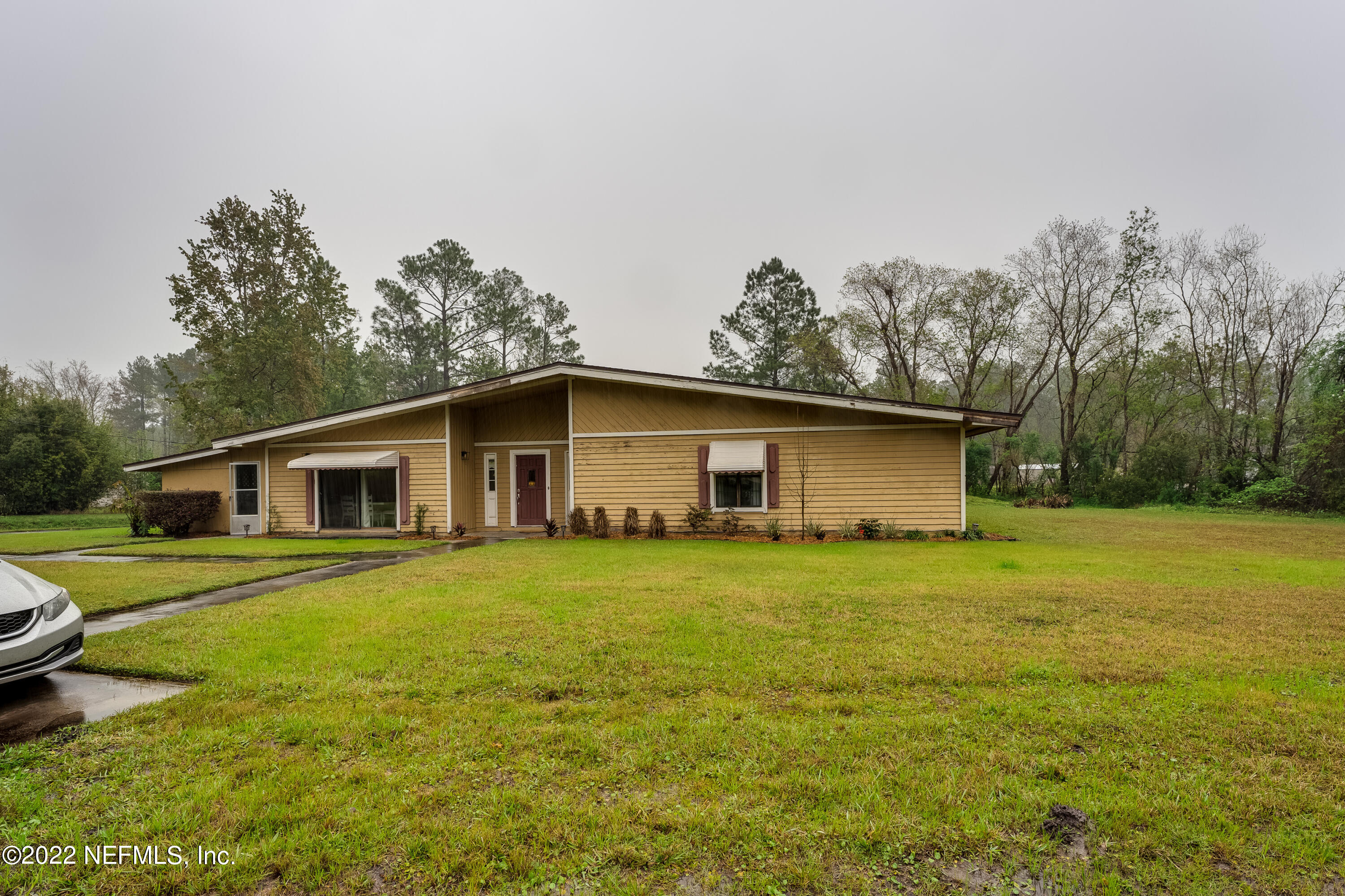 54528 Vikki Road Callahan, FL 32011 - Photo 4 of 41 a house view with a garden space