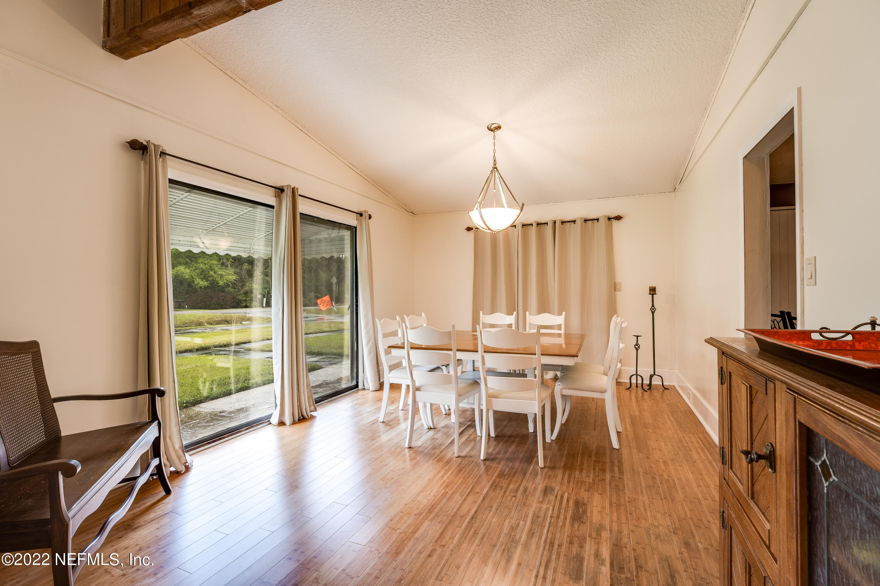 54528 Vikki Road Callahan, FL 32011 - Photo 9 of 41 a view of a dining room with furniture window and wooden floor