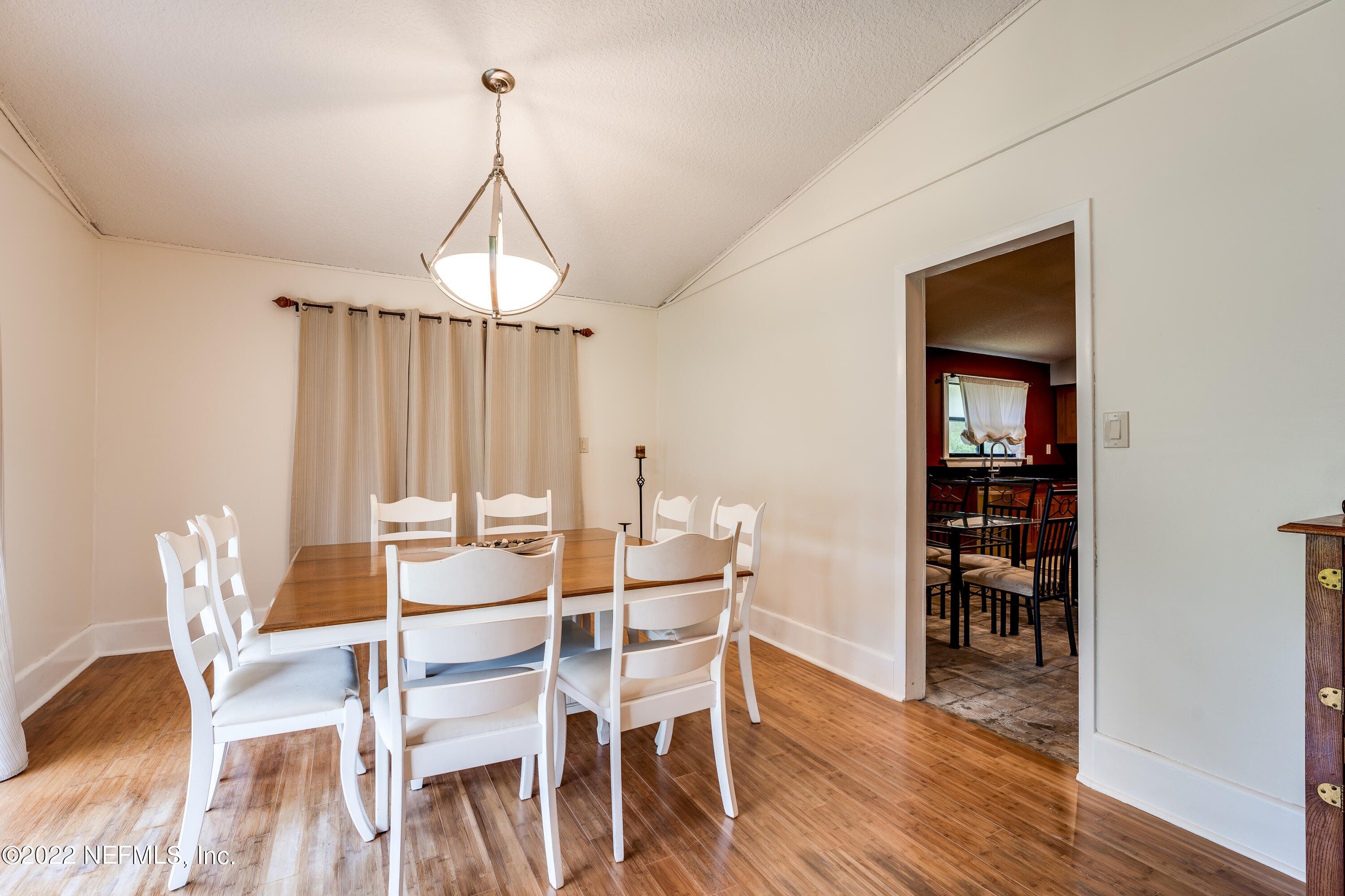 54528 Vikki Road Callahan, FL 32011 - Photo 10 of 41 a view of a dining room with furniture window and wooden floor